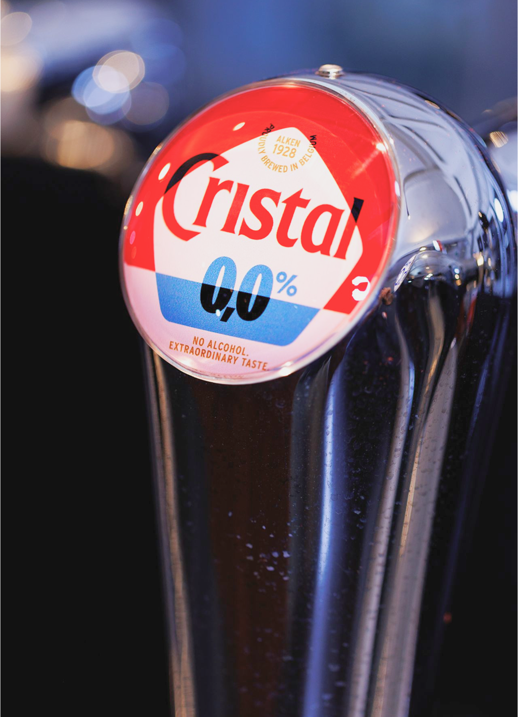 A tap handle displaying the new Cristal 0% logo.
