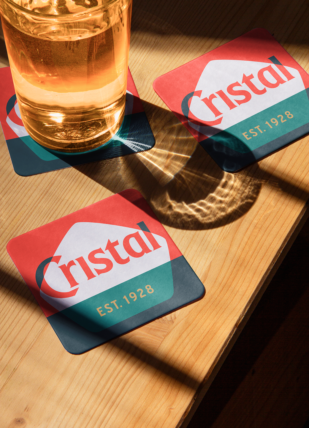 The Cristal logo on coasters.