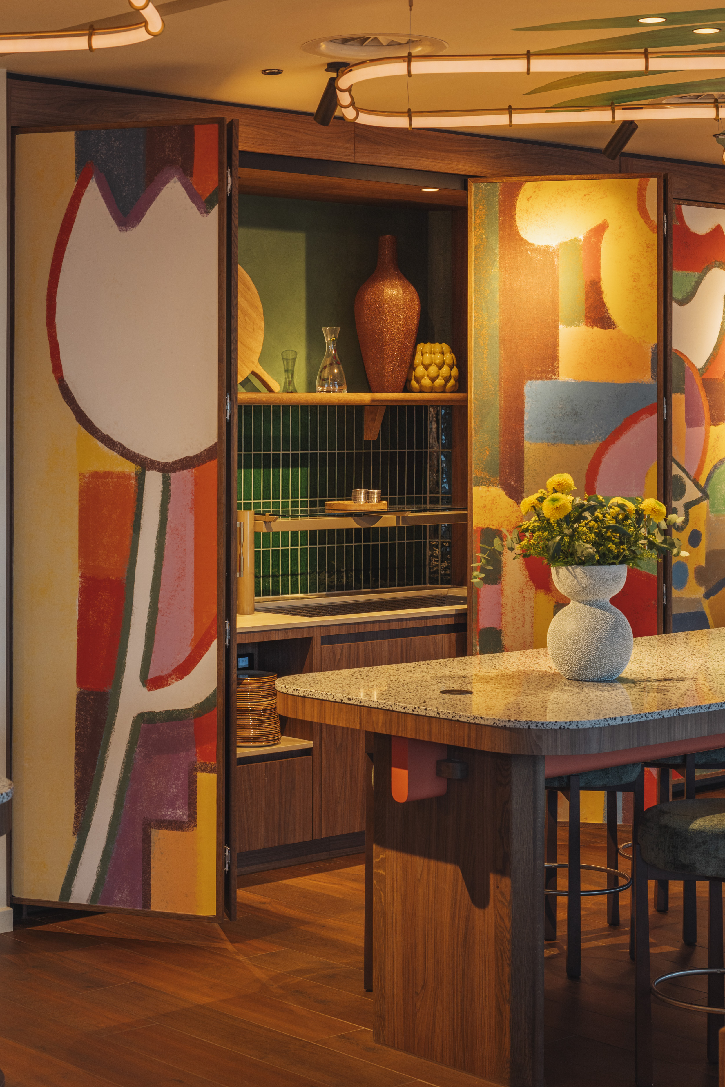 A still image of the mural doors in the dining area.