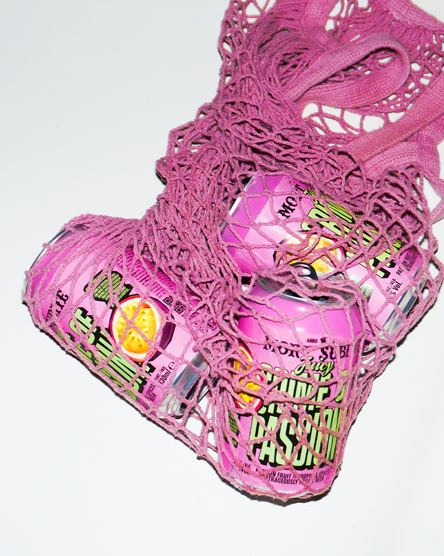 Crime of Passion cans in a mesh pink bag.