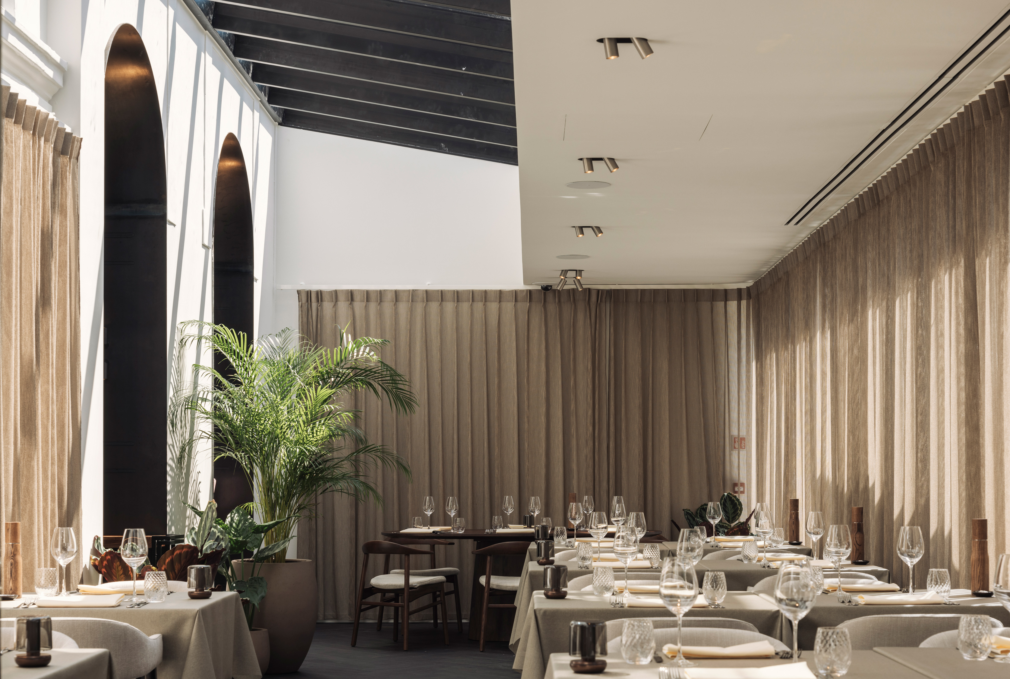 The airy veranda offers a change in elements from the dark bar.